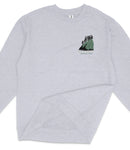 A gray sweatshirt with a small graphic design on the front, depicting a mountain landscape with trees.