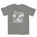a gray t - shirt with a picture of a wave and palm trees