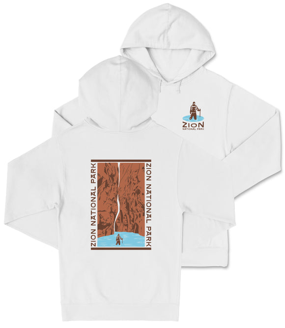 A white hooded sweatshirt with a graphic design depicting a person standing in front of a canyon or rock formation.