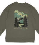 A graphic t-shirt with a nature-inspired design featuring a mountain landscape with pine trees and a body of water.
