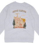 A gray sweatshirt with a graphic design depicting a scenic landscape with a tall tower, trees, and mountains.