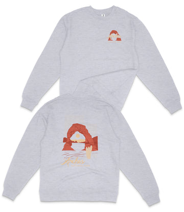 a gray sweatshirt with a graphic design on the back.