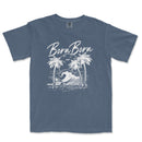 a blue t - shirt with a picture of a wave and palm trees