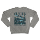 a gray sweatshirt with a mountain scene on it