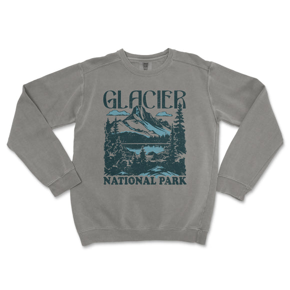a gray sweatshirt with a mountain scene on it