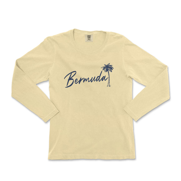 a women's long sleeve shirt with a palm tree in the background