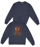 a navy blue sweatshirt with a graphic design on the back, depicting a tall tree with a sun-like symbol above it, surrounded by green trees.