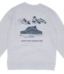 A gray sweatshirt with a graphic design depicting a cabin and mountains in the background, along with the text "GRAND Teton NATIONAL PARK".