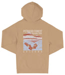 A beige hooded sweatshirt with a graphic design depicting a scenic landscape, including a mountain range and a body of water. The text on the back of the sweatshirt reads "PETRIFIED FOREST NATIONAL PARK ARIZONA".