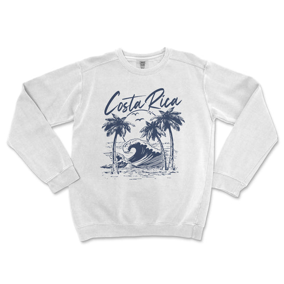 a white sweatshirt with a blue graphic of a wave and palm trees