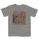 a gray t - shirt with a picture of a mountain scene
