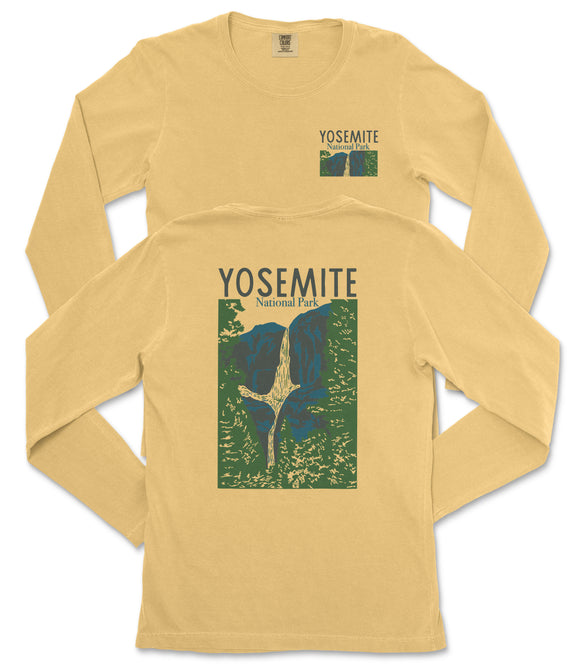 a yellow long-sleeved t-shirt with a graphic design depicting a mountain range and the text "Yosemite National Park" printed on it.