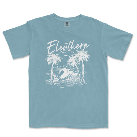 a blue t - shirt with a picture of a wave and palm trees