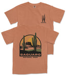 a t-shirt with a graphic design depicting a desert landscape with cacti and mountains, along with the text "Saguaro National Park".