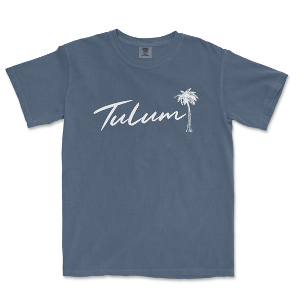 a blue t - shirt with the word tulum written in white