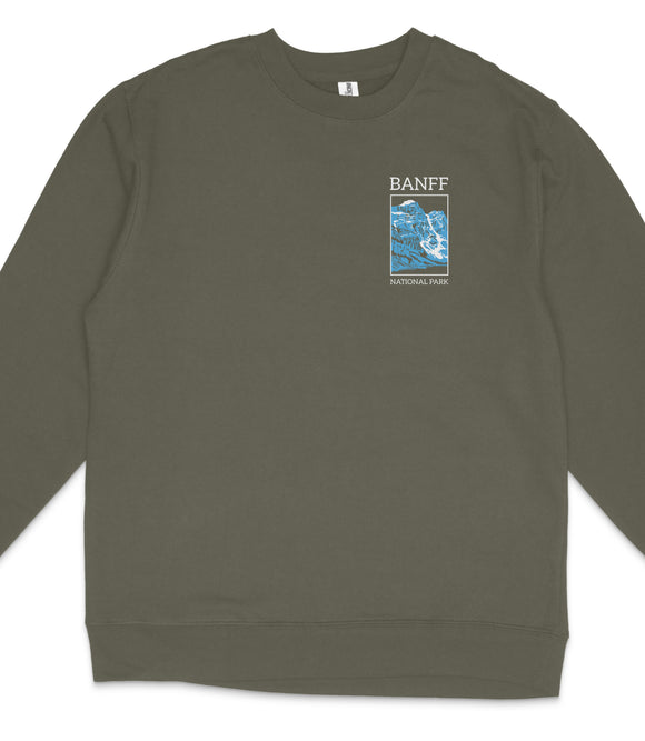 A gray sweatshirt with a graphic design on the left side, depicting a mountain range with a blue sky.