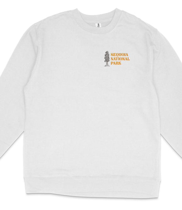 A white long-sleeved shirt with a graphic design on the left side, depicting a tree and the text "SEQUOIA NATIONAL PARK" in orange.