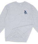 A gray long-sleeved shirt with a small graphic design on the left side.