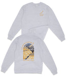A grey sweatshirt with a graphic design depicting a canyon and the text "The Grand Canyon National Park" printed on the back.