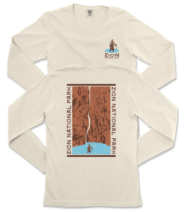 a white long-sleeved t-shirt with a graphic design depicting a person standing on a cliff overlooking a body of water.