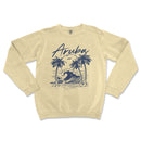 a cream sweatshirt with an image of an ocean wave and palm trees