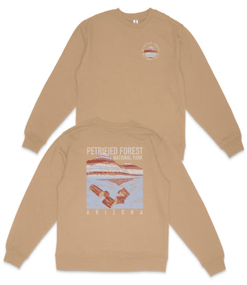 a tan sweatshirt with a graphic design on the back, depicting a desert landscape with a mountain and a satellite.