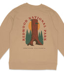 A beige sweatshirt with a graphic design featuring a tall tree and the text "REDWOOD NATIONAL PARK NORTHERN CALIFORNIA".