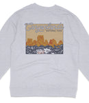 A gray sweatshirt with a graphic design depicting a scenic landscape with mountains and a body of water.
