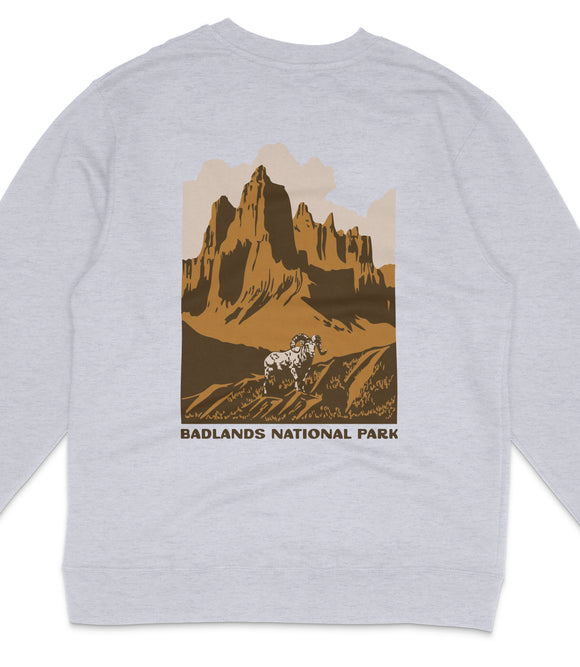 A gray sweatshirt with a graphic design depicting a mountain landscape with a bighorn sheep in the foreground.