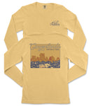 A yellow long-sleeved t-shirt with a graphic design depicting a scenic landscape, specifically the Canyonlands National Park.