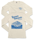 a cream-colored long-sleeved t-shirt with a graphic design depicting a mountain landscape and a lake. The design includes the text "Lassen Volcanic National Park" printed on the back of the shirt.