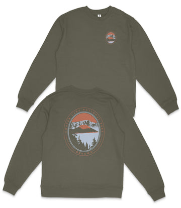 a pair of olive green sweatshirts with a graphic design on the back. The design features a circular emblem with a mountain landscape and a lake, surrounded by a border with orange and blue colors.