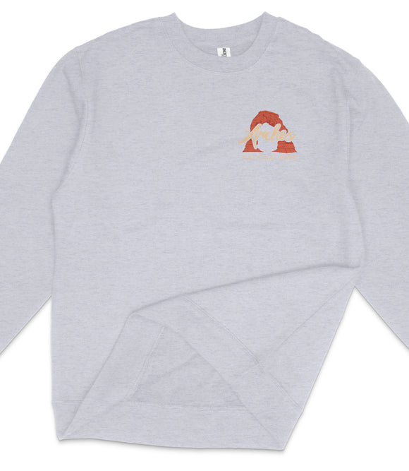 A gray sweatshirt with a graphic design on the front.