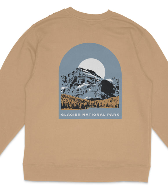 A beige sweatshirt with a graphic design depicting a mountain landscape with a large moon in the sky.