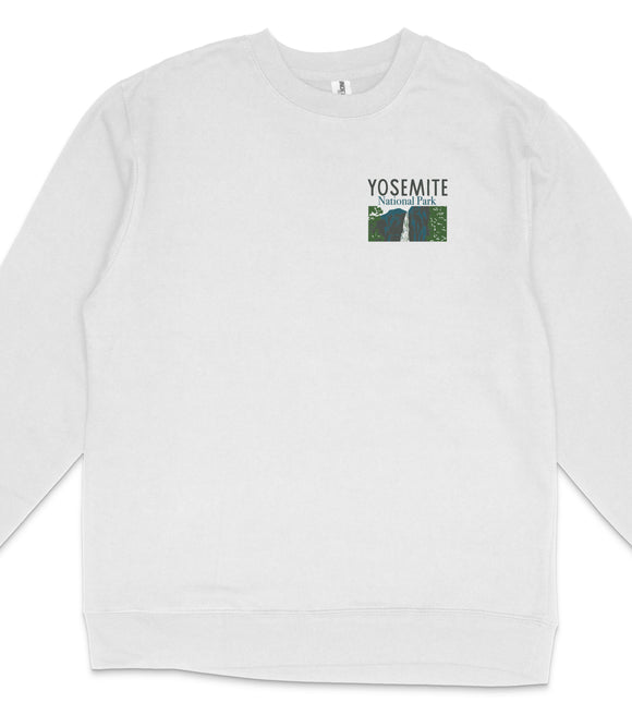 A white long-sleeved shirt with a graphic design on the front, featuring the text "YOSEMITE NATIONAL PARK" and a graphic of a mountain range.