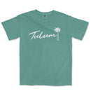 a green t - shirt with the word tulum written in white