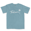 a light blue t - shirt with the word tulum written in white