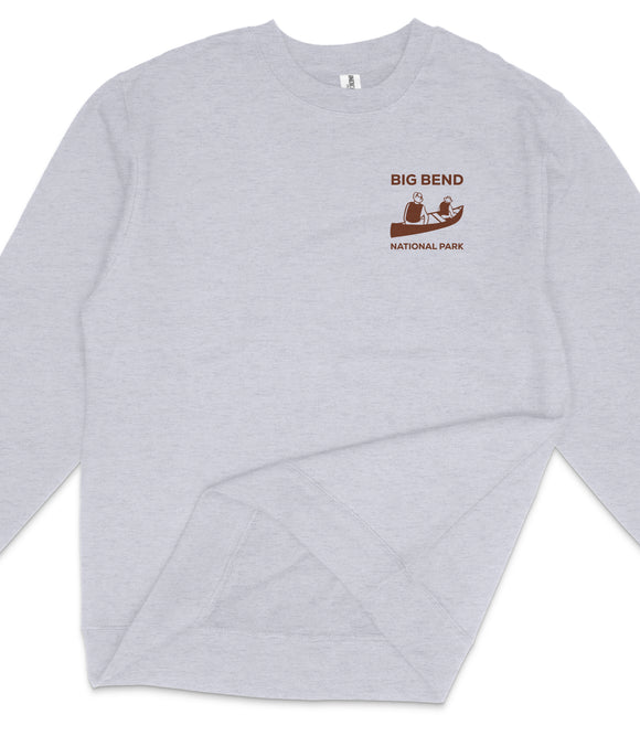 A gray long-sleeved shirt with a logo on the left side.