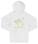 A white hooded sweatshirt with a graphic design depicting a desert landscape with a tree and a small moon.