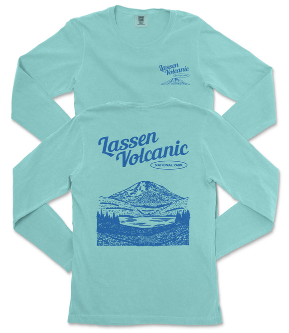 A light blue long-sleeved t-shirt with a graphic design depicting a mountain landscape and a lake.