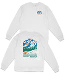 A white long-sleeved shirt with a graphic design depicting a mountain landscape and a bear.