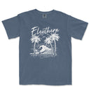 a blue t - shirt with a picture of a wave and palm trees