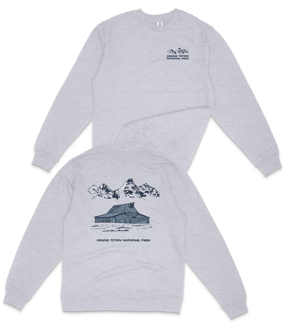 A grey long-sleeved shirt with a graphic design depicting a building and mountains, along with text that reads "Grand Teton National Park".