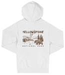 A white hooded sweatshirt with a graphic design depicting a bear and a landscape with a steam vent, along with the text "Yellowstone National Park".