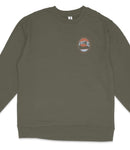 A dark green long-sleeved shirt with a circular logo on the left side.