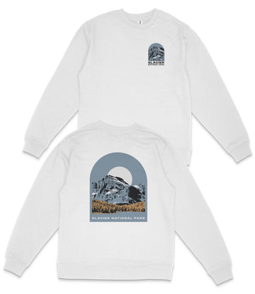 A white long-sleeved shirt with a graphic design depicting a mountain landscape and the text "GLACIER NATIONAL PARK" printed on the back.