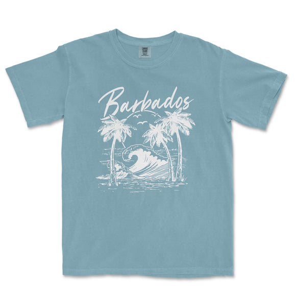 a blue t - shirt with a picture of a surfboarder riding a wave