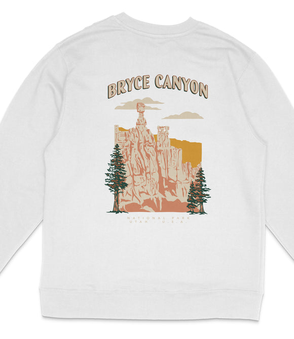 A white long-sleeved shirt with a graphic design depicting Bryce Canyon, a famous national park in the United States.