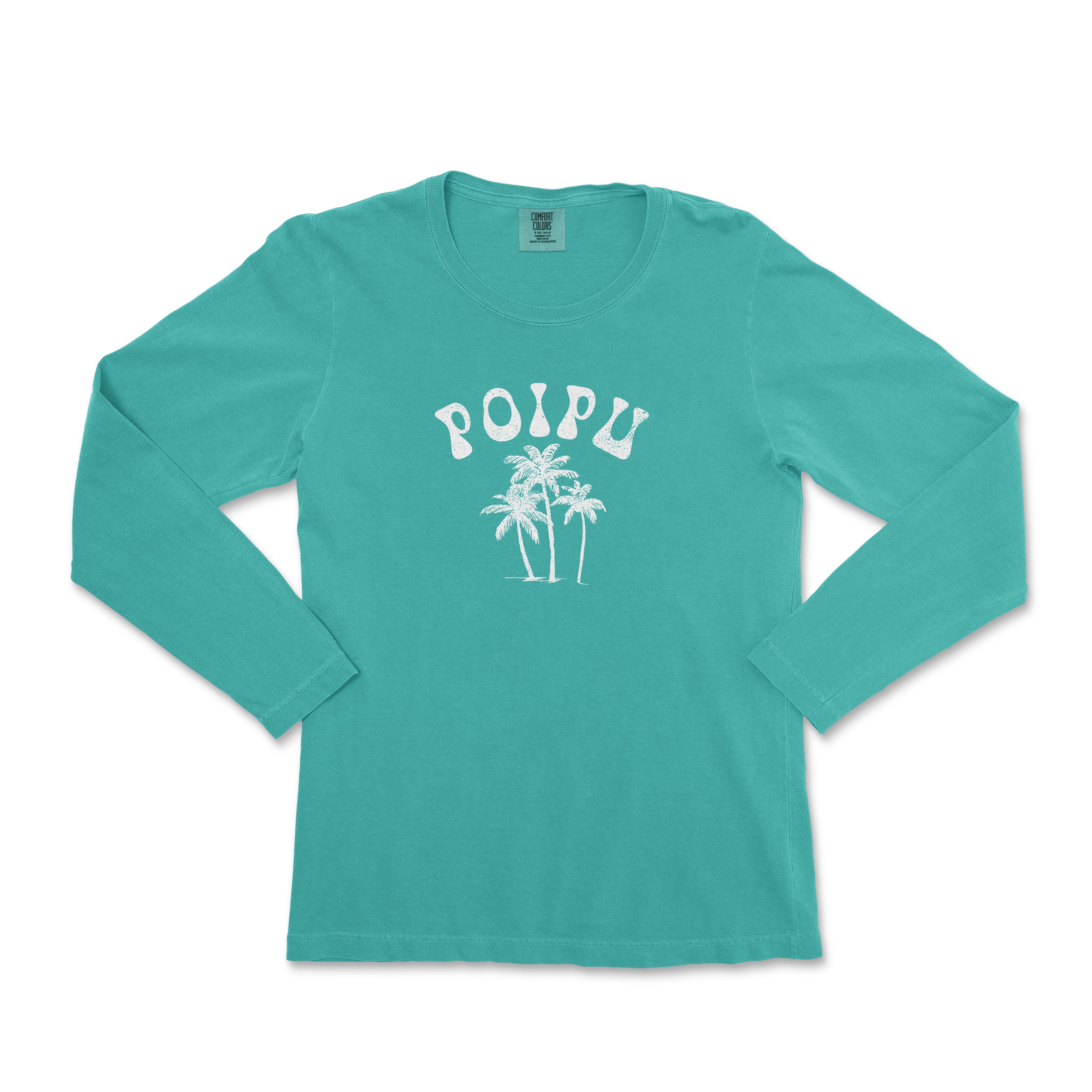 a women's long - sleeved shirt with palm trees printed on the front