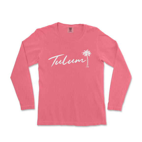 a women's pink long sleeve shirt with the word tuluum in white